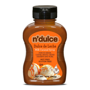 Bottle of n'dulce Dulce de Leche milk caramel syrup, labeled for use with ice cream, coffee, fruits, and desserts, marked as nut-free and gluten-free.