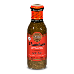 Bottle of Gaucho Ranch Chimichurri marinade, labeled as a mild hot condiment for BBQ and dipping, highlighting ingredients like parsley, garlic, rosemary, and red peppers.
